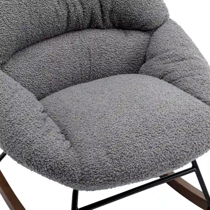 Fauteuil à bascule capitonné